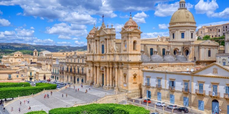 beige concrete building under blue sky during daytime