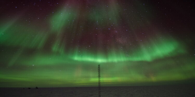 green and pink light in the sky
