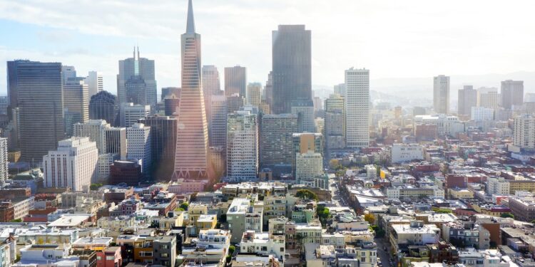 aerial photography of concrete buildings under blue cloudy sky
