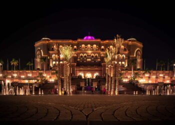brown mansion with lights during nighttime