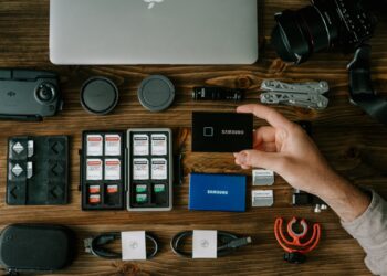 person holding blue and white box