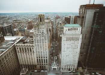 white high rise building near body of water during daytime