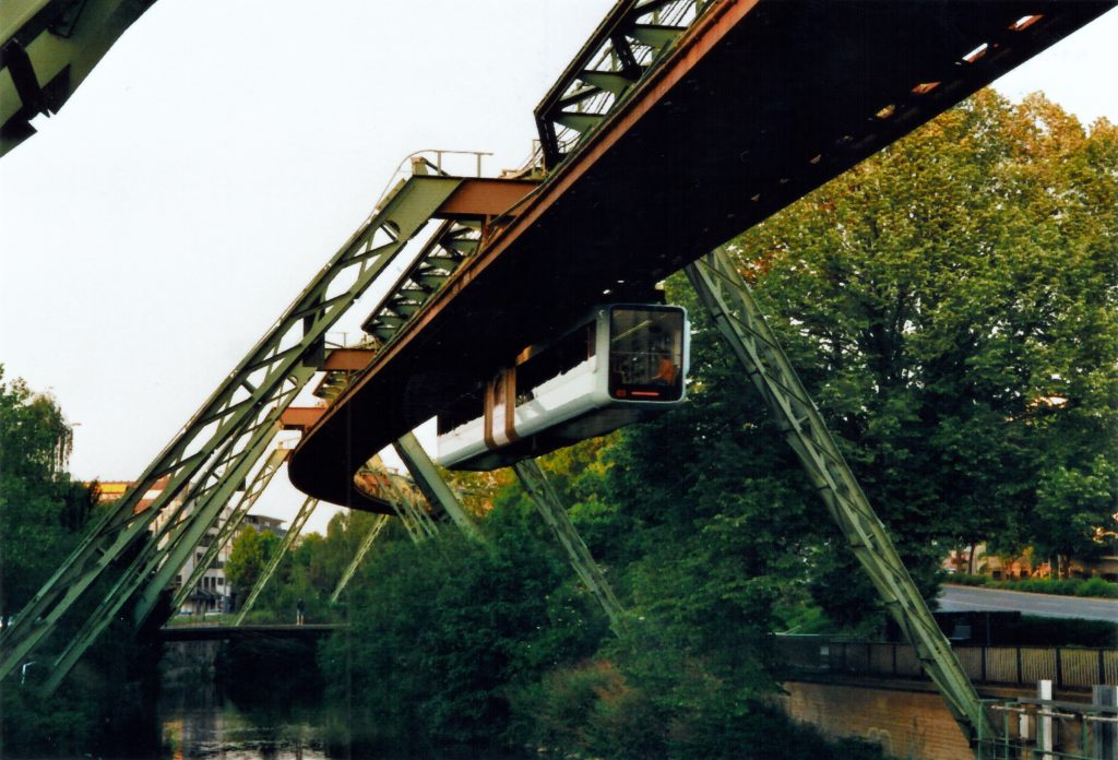 brown metal bridge over river