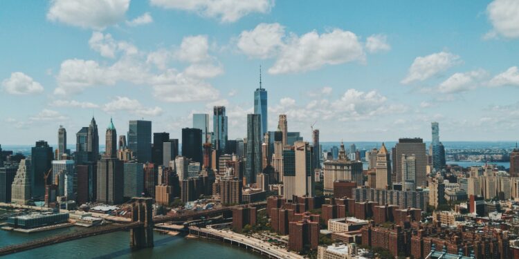 wide angle photo of Brooklyn Bridge under cloudy sky