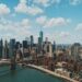 wide angle photo of Brooklyn Bridge under cloudy sky