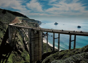 grey concrete road under blue sky