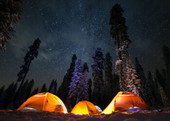three tents under stars