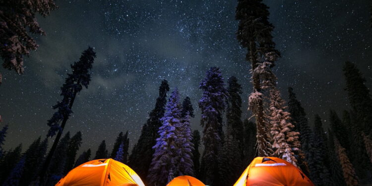 three tents under stars