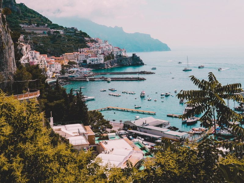 landscape photo of village houses near ocean