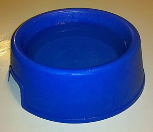 English: Large blue water bowl for dogs, half ...